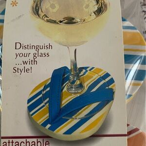 Package of four sandal wine glass holder. Brand new